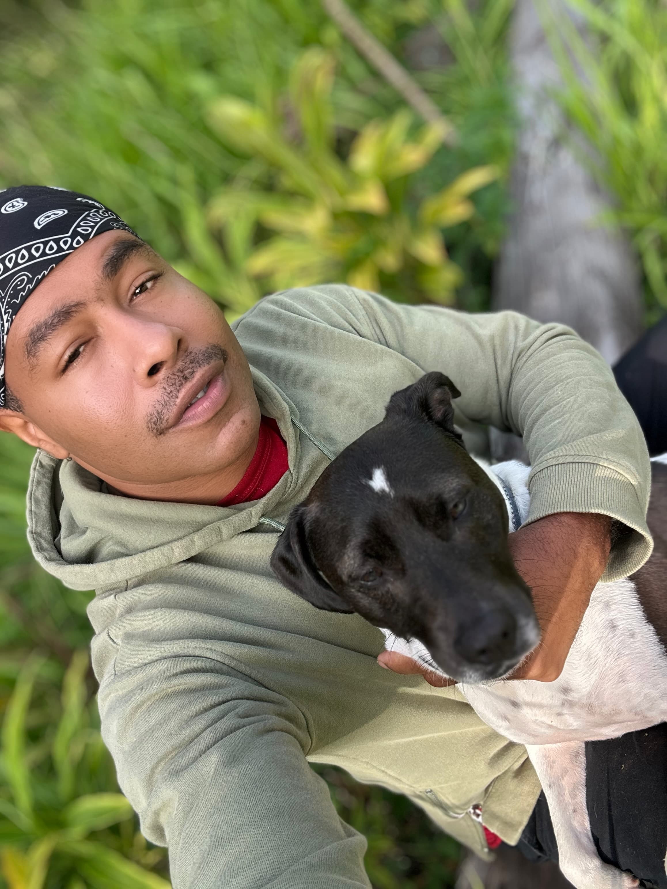 Jeffon with his dog outdoors in nature